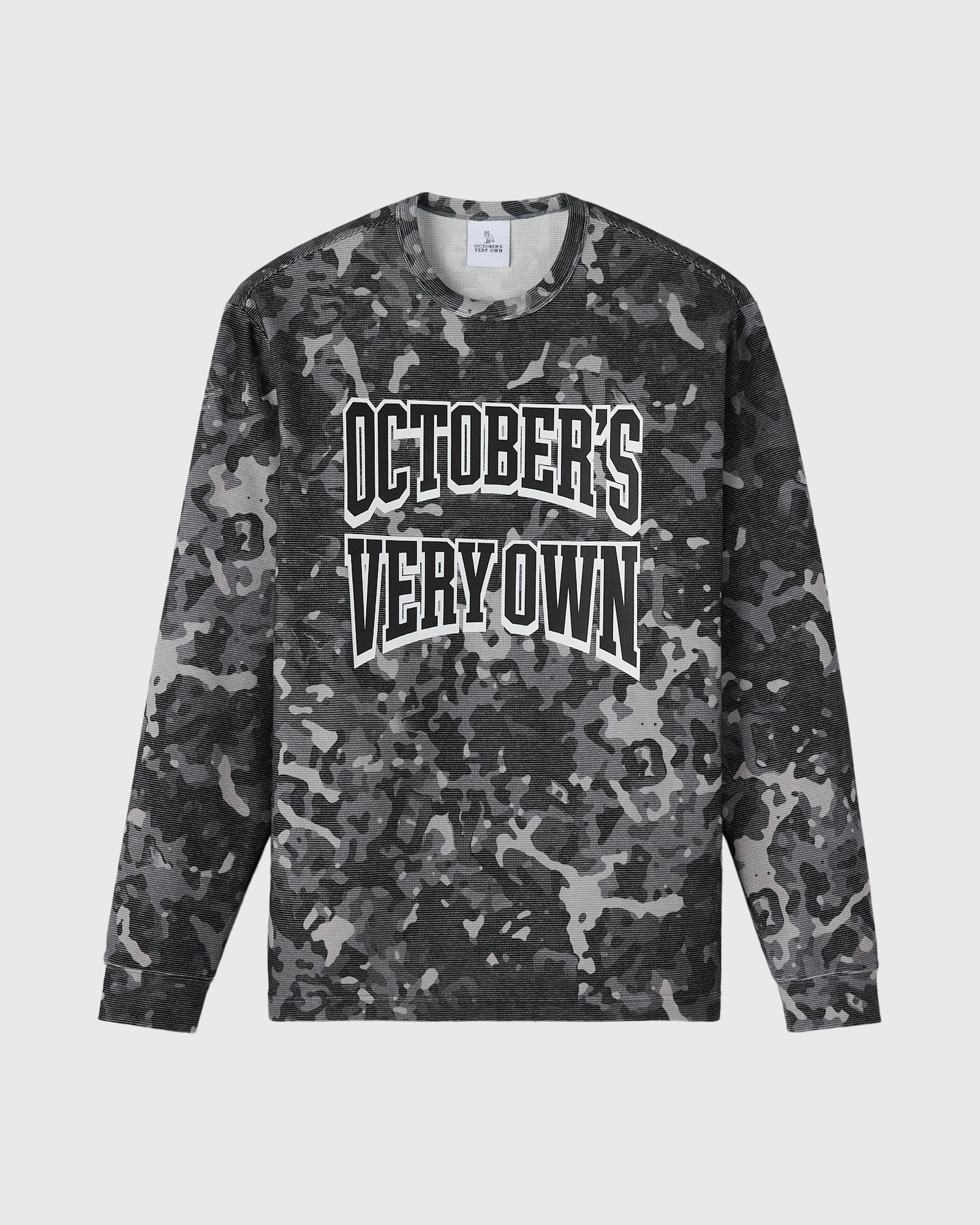 Grey camouflage long-sleeve tee with white "October's Very Own" text graphic on chest.