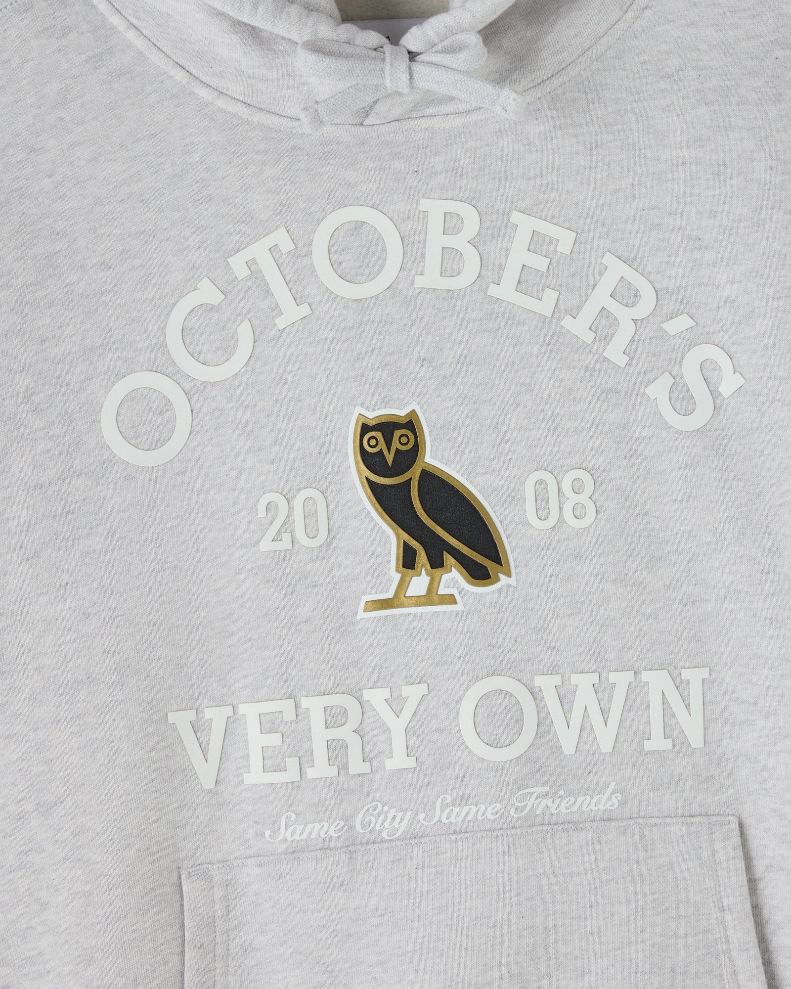 Ash heather grey hoodie with "Octobers Very Own" text and owl graphic on chest, drawstring hood visible.