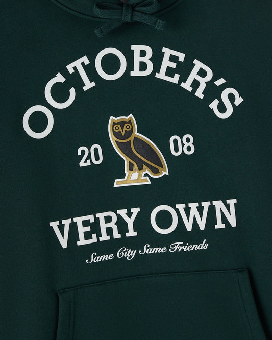 Midnight green hoodie with white "Octobers" text, owl graphic, "2008" numbers, and cursive script below on chest.
