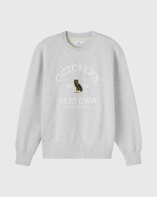 Ash heather grey crewneck sweatshirt with "Octobers Very Own" text and owl graphic on chest.