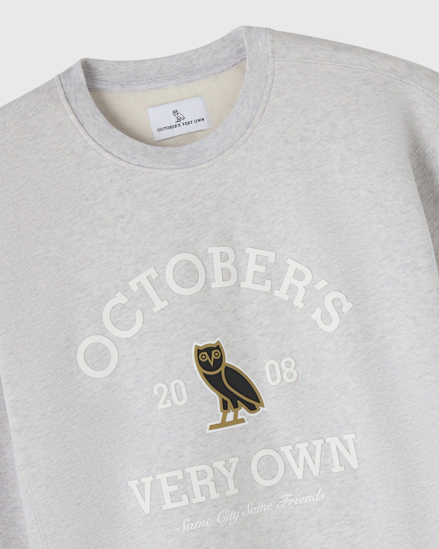 Ash heather grey crewneck sweatshirt with "Octobers Very Own" text and owl graphic on chest.