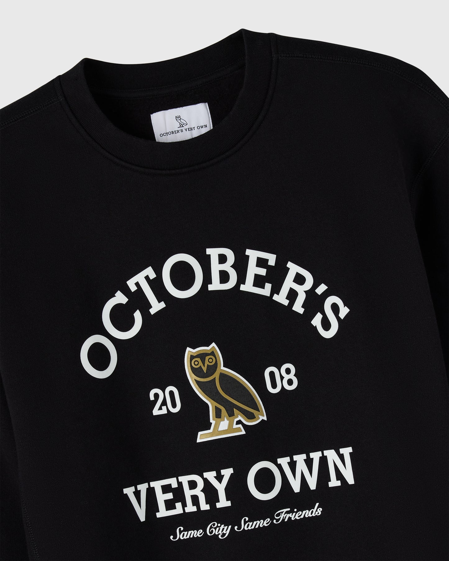 Black crewneck sweatshirt with white text reading "October's Very Own 2008" and gold owl graphic.
