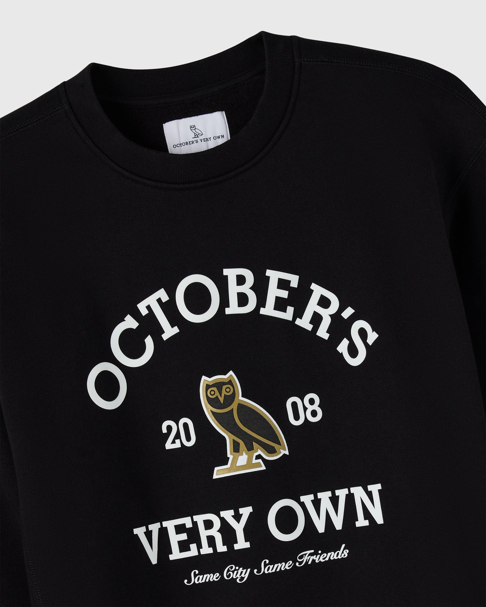 Black crewneck sweatshirt with white text reading "October's Very Own 2008" and gold owl graphic.