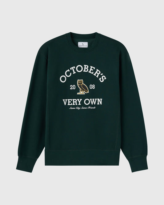 Midnight green crewneck sweatshirt with white text reading "October's 2008 Very Own" and an owl graphic.