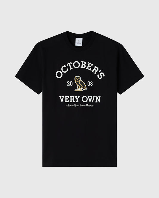 Black crew neck t-shirt with white text reading "Octoberis Very Own" and gold owl graphic with "2008" below.
