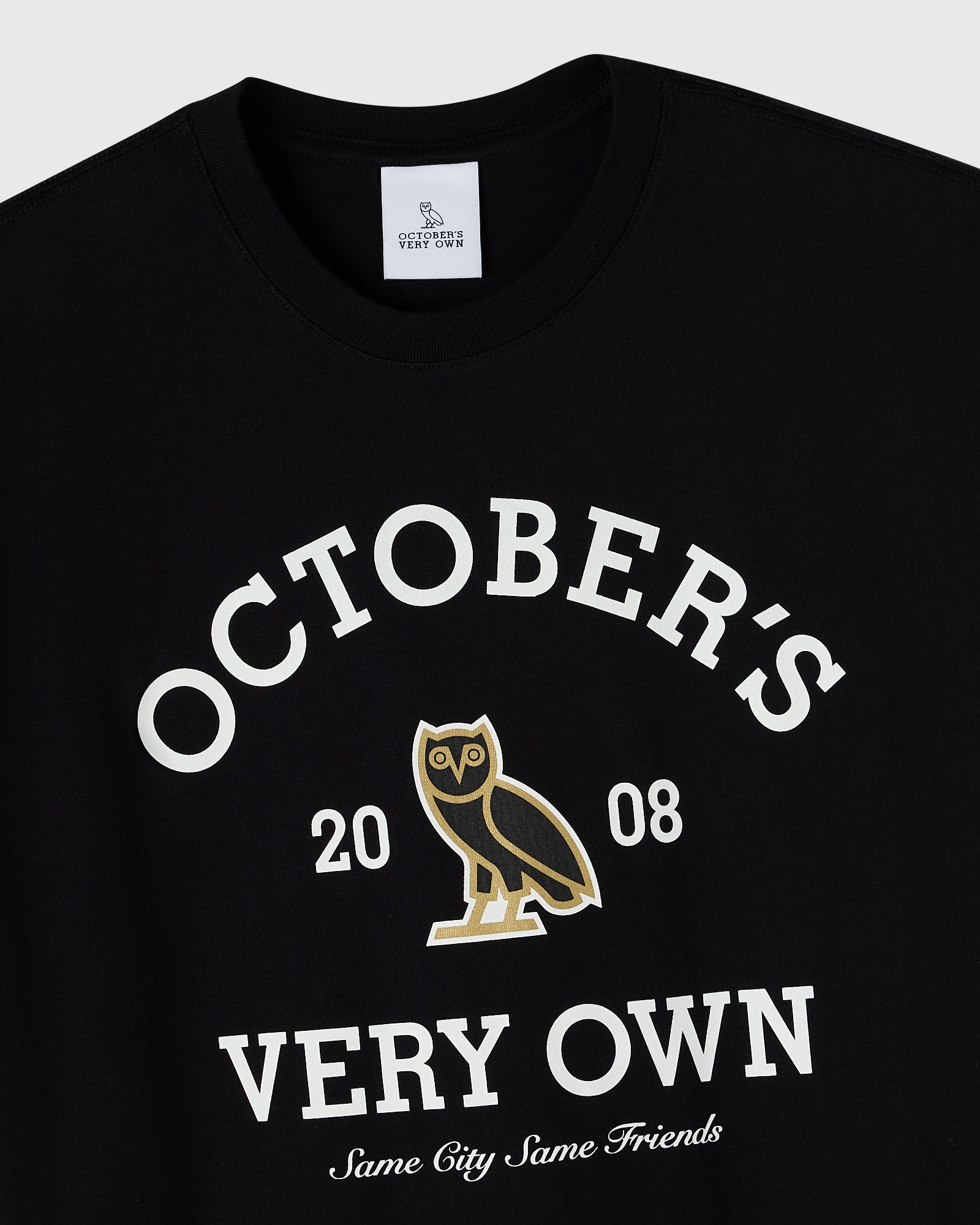 Black crew neck tee with white text reading "October's Very Own" and gold owl graphic with "2008" and "Same City Same Friends