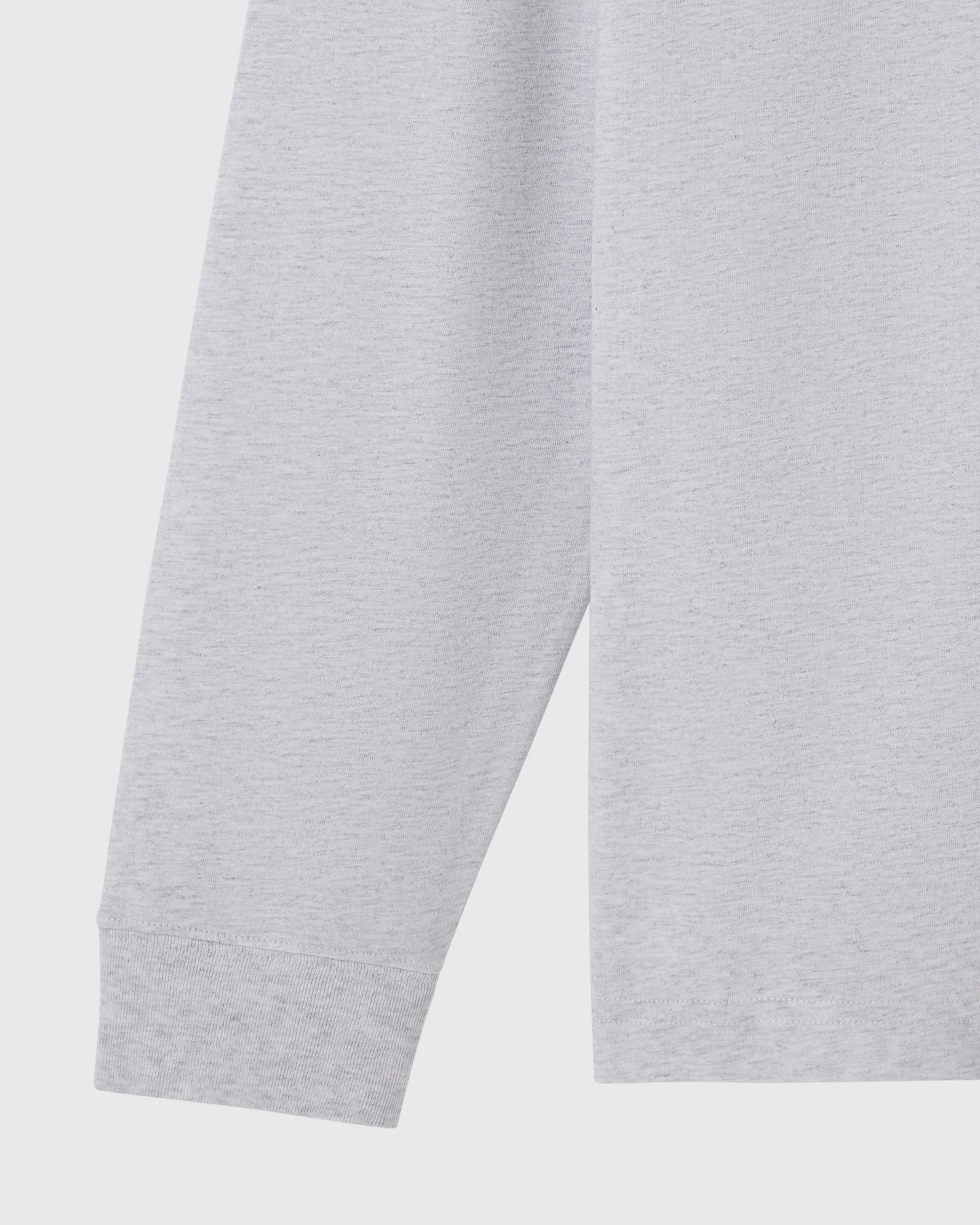 Ash heather grey long-sleeve tee with ribbed cuffs and hem, shown on flat lay.