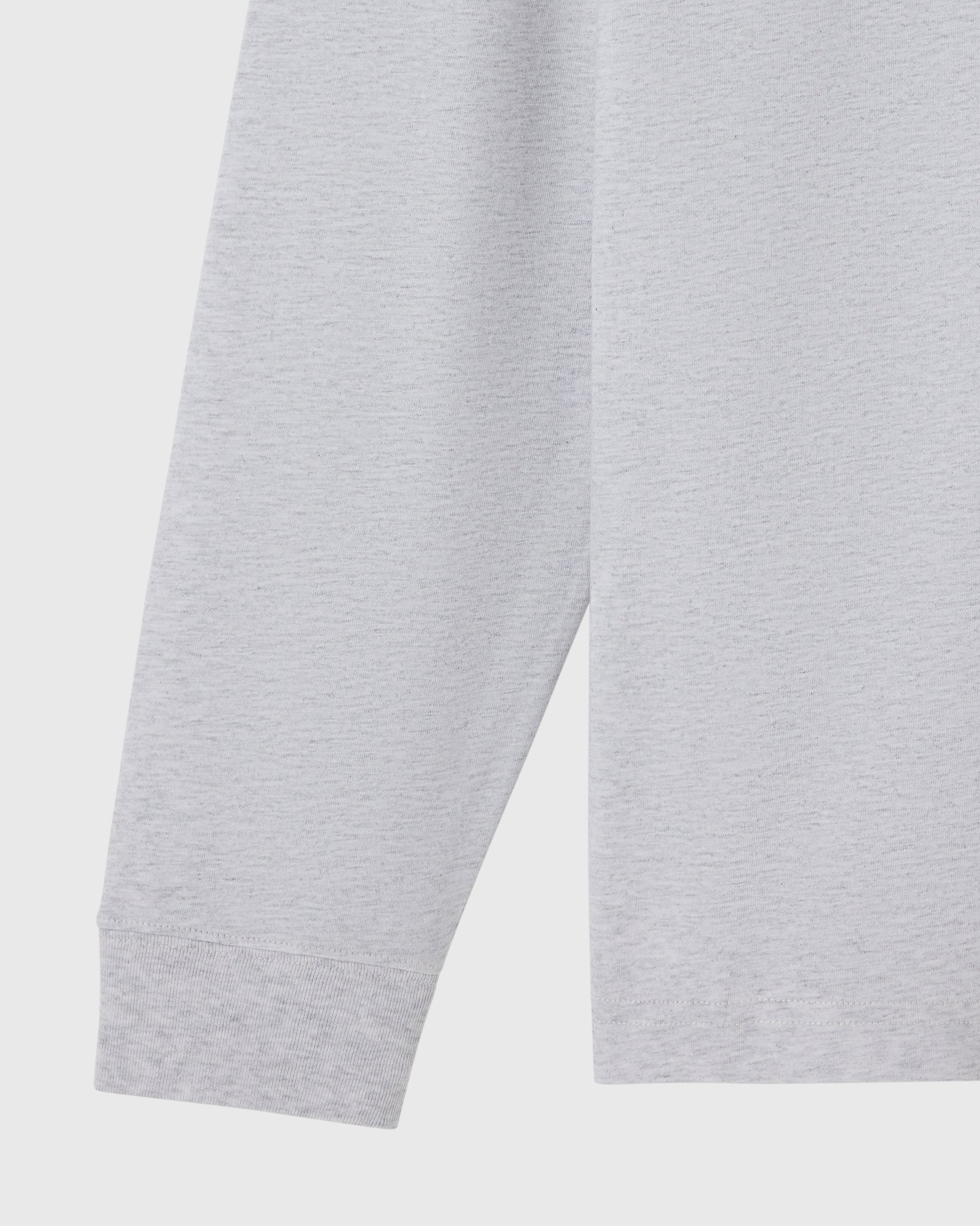 Ash heather grey long-sleeve tee with ribbed cuffs and hem, shown on flat lay.