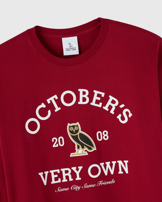 Deep red long-sleeve tee with white "October's Very Own" text, owl graphic, and "2008" and "Same City Same Friends" details.