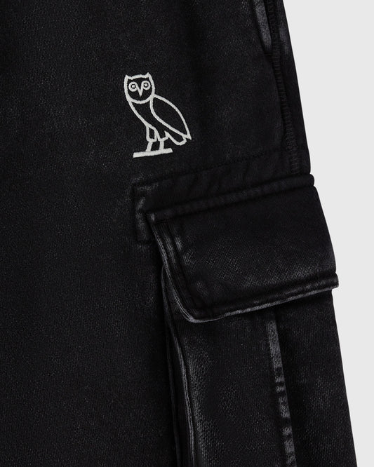 Black cargo sweatpant with white owl embroidery on chest and flap pocket on thigh.