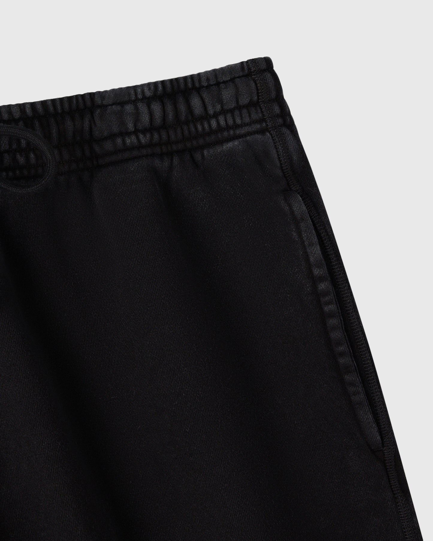 Black sweatshorts with elastic waistband and ribbed trim detail.