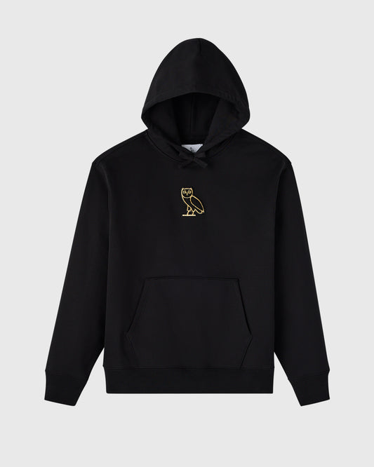 Black hoodie with gold owl emblem on chest, drawstring hood, and front pouch pocket.