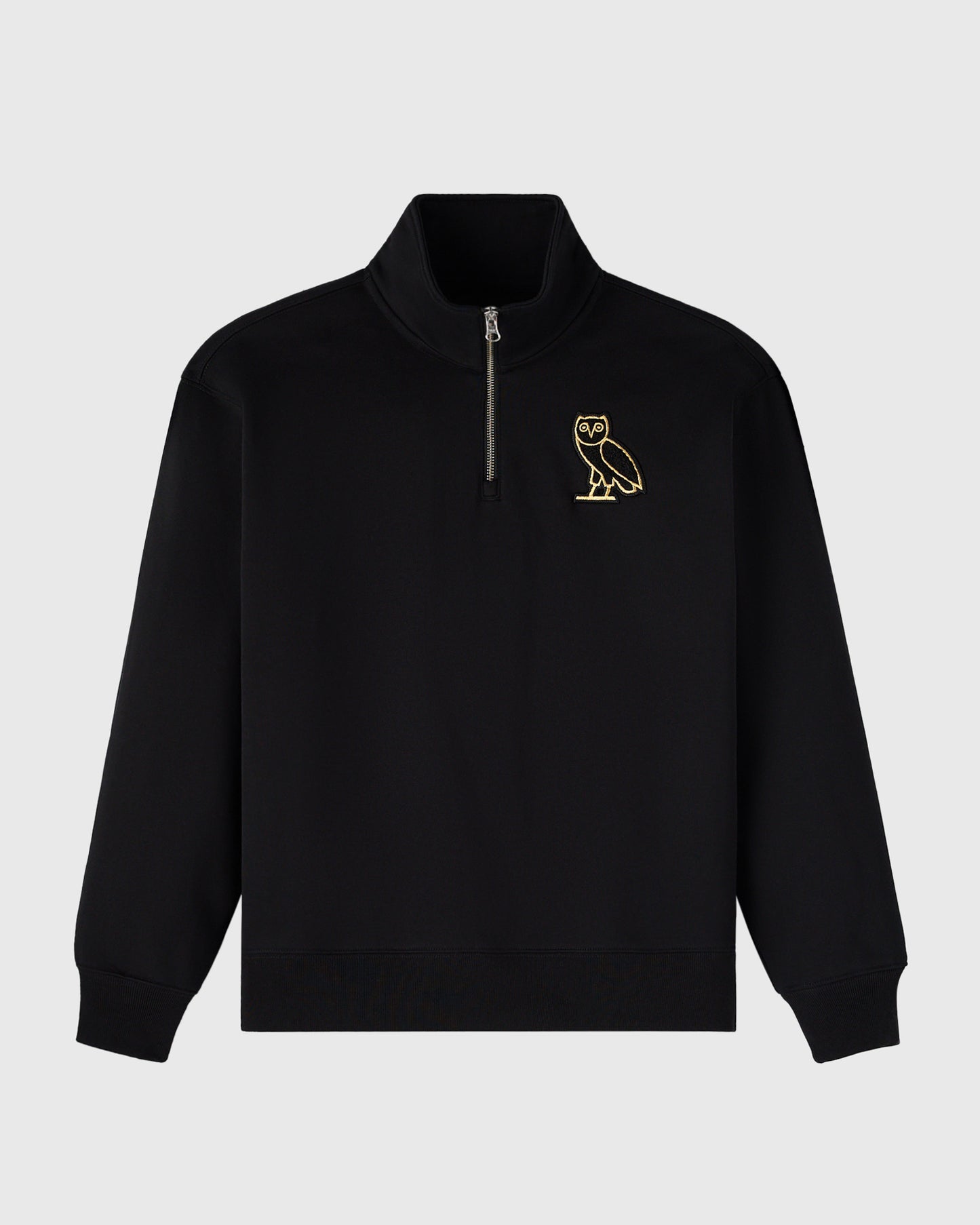 Black quarter-zip mockneck sweatshirt with gold owl embroidery on chest.