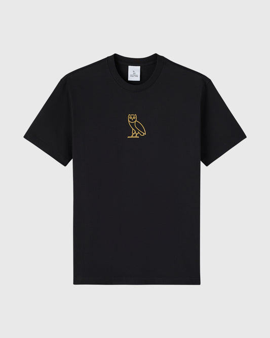 Black crew neck t-shirt with small gold owl embroidered on chest.
