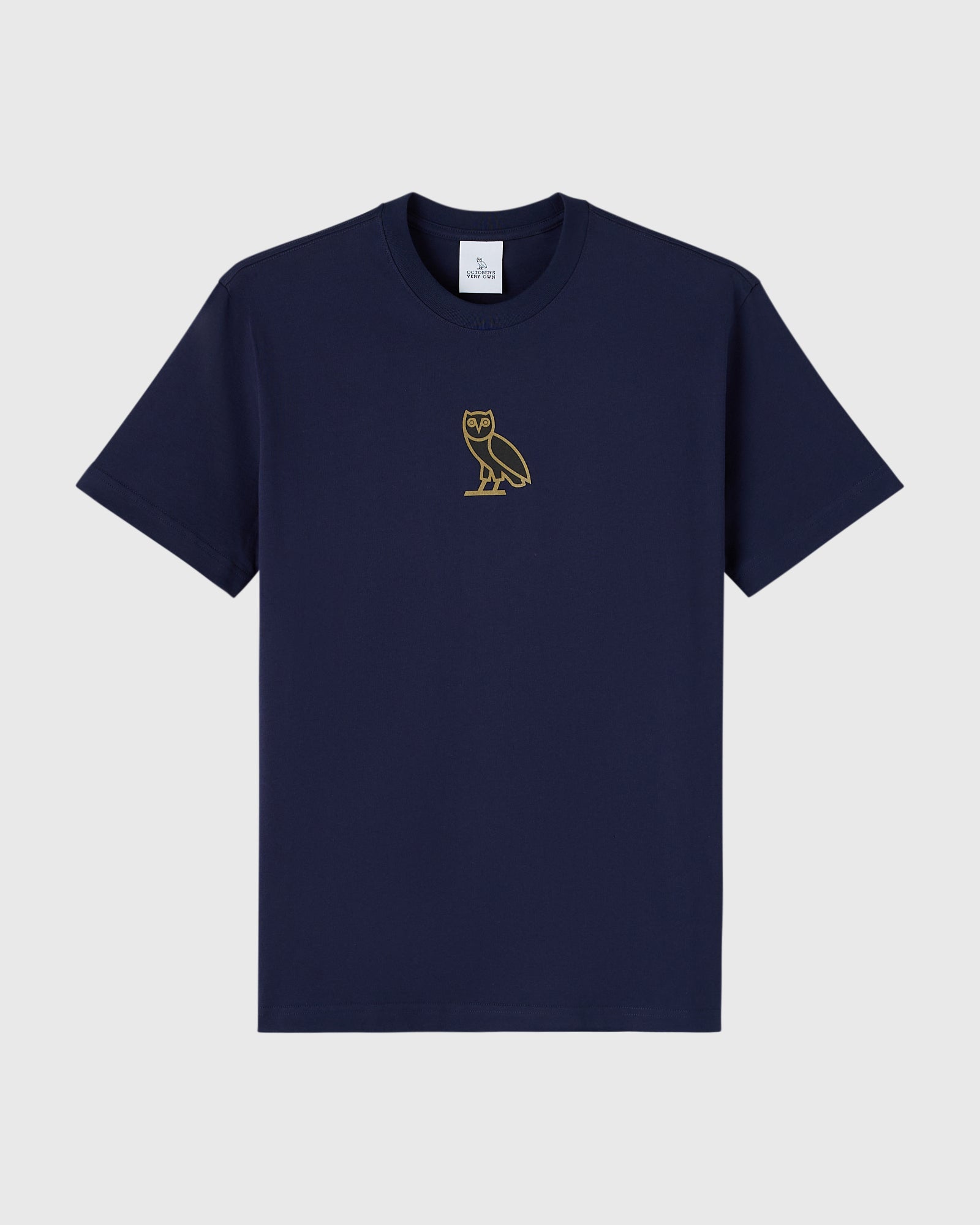 Navy short-sleeve crewneck tee with small gold owl embroidery on chest.