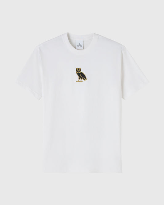 White short-sleeve t-shirt with small black and gold owl embroidered on chest.