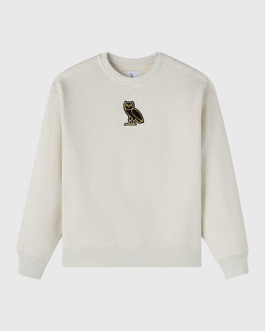 Ash heather grey crewneck sweatshirt with small embroidered owl logo on chest.
