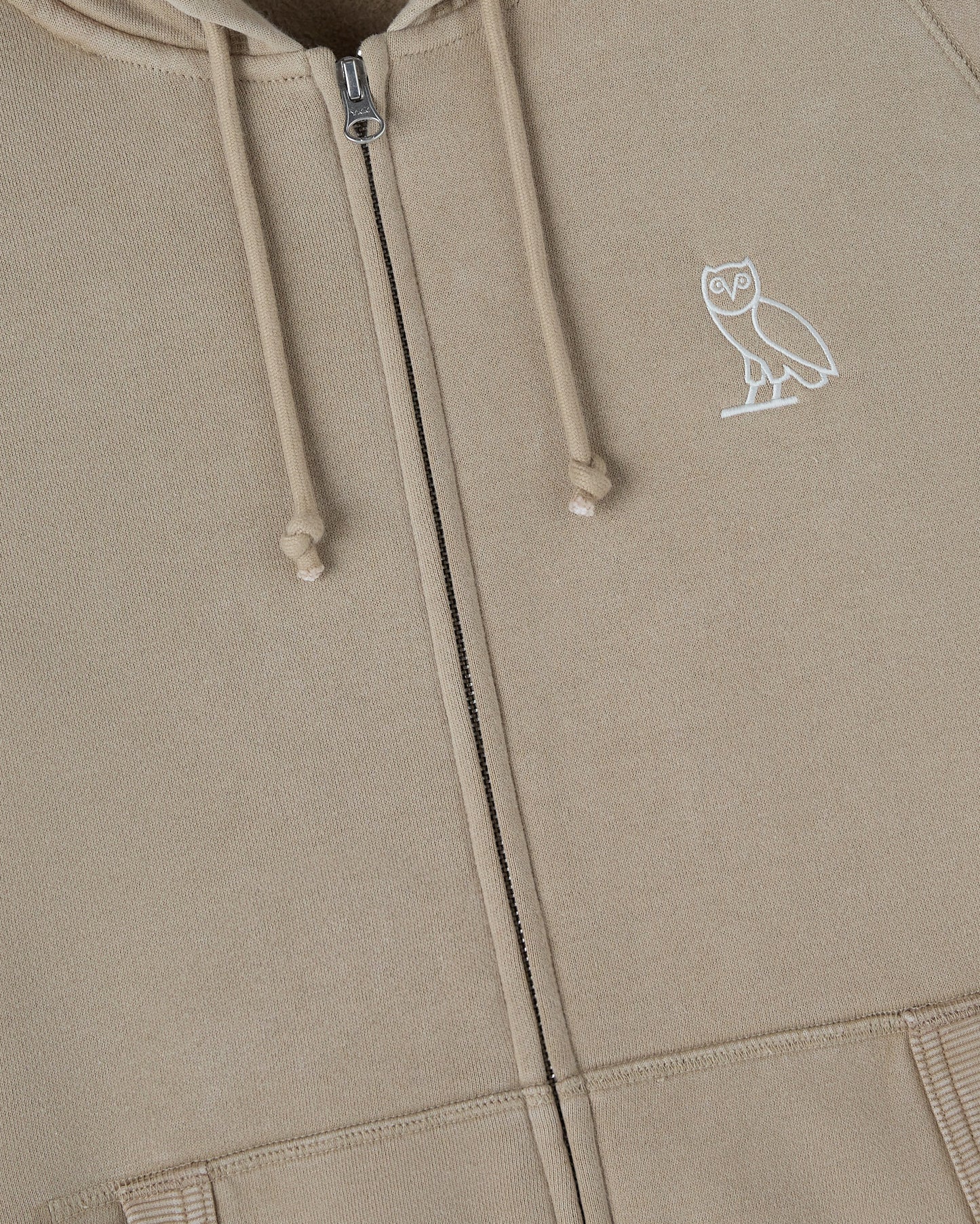 Sandstone raglan hoodie with full-length zipper, drawstring hood, and white owl emblem on chest.