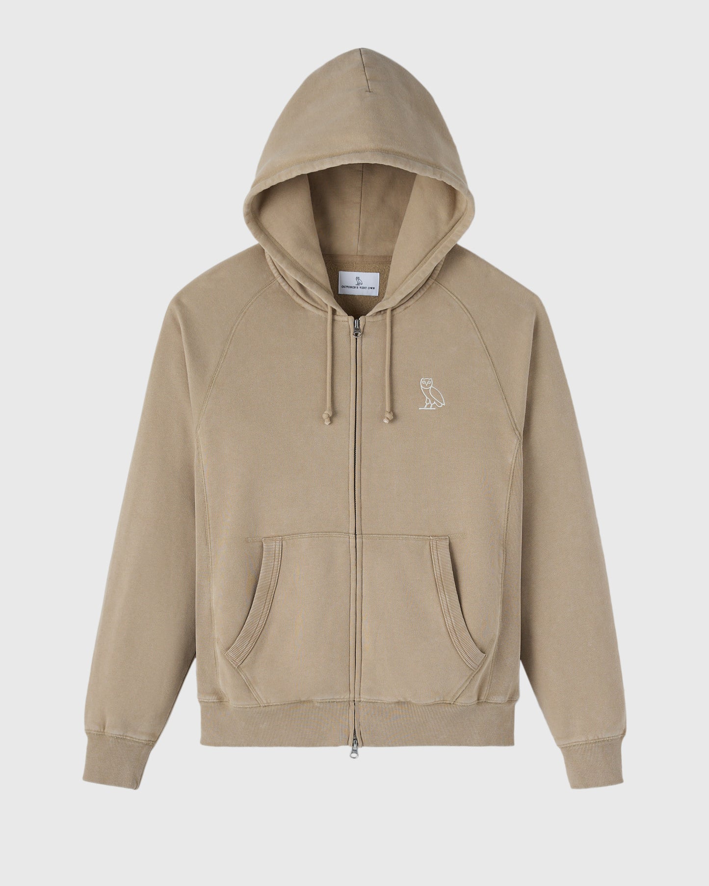 Sandstone raglan hoodie with full-length zipper, drawstring hood, and small owl emblem on chest.