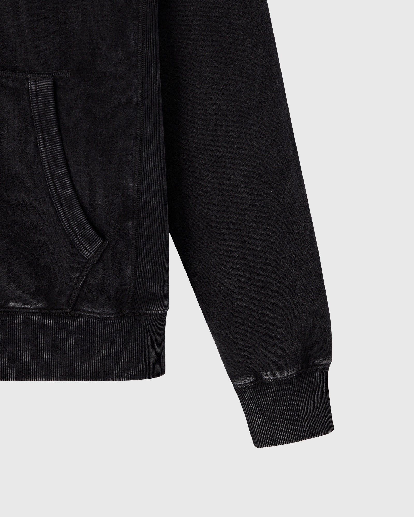 Black raglan hoodie with front zip closure, kangaroo pocket, and ribbed cuffs and hem.