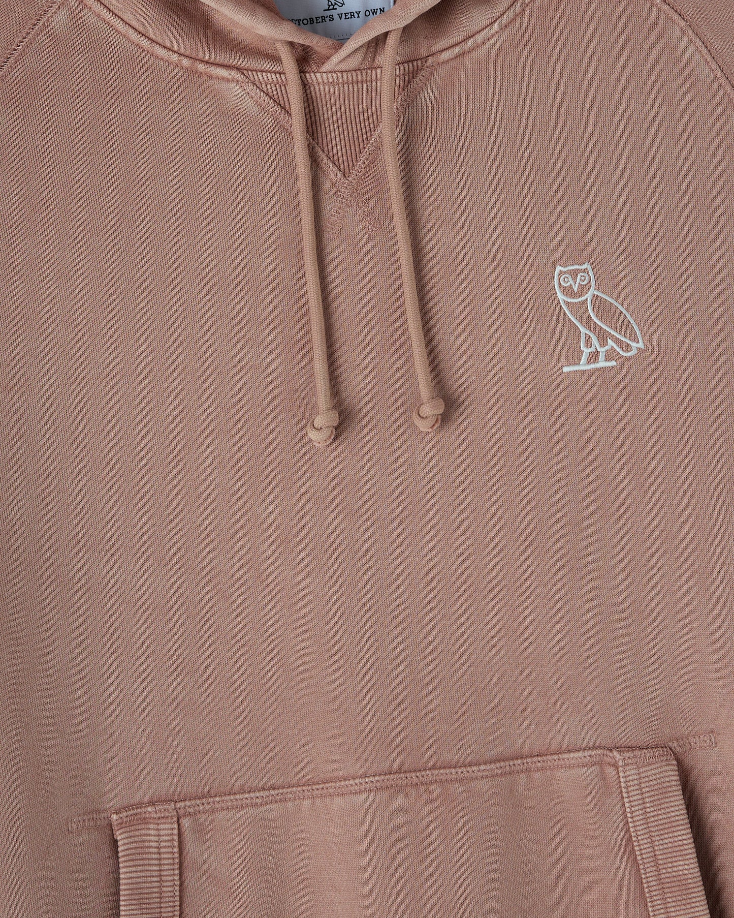Clay pink raglan hoodie with white owl embroidery on chest and ribbed cuffs and hem.