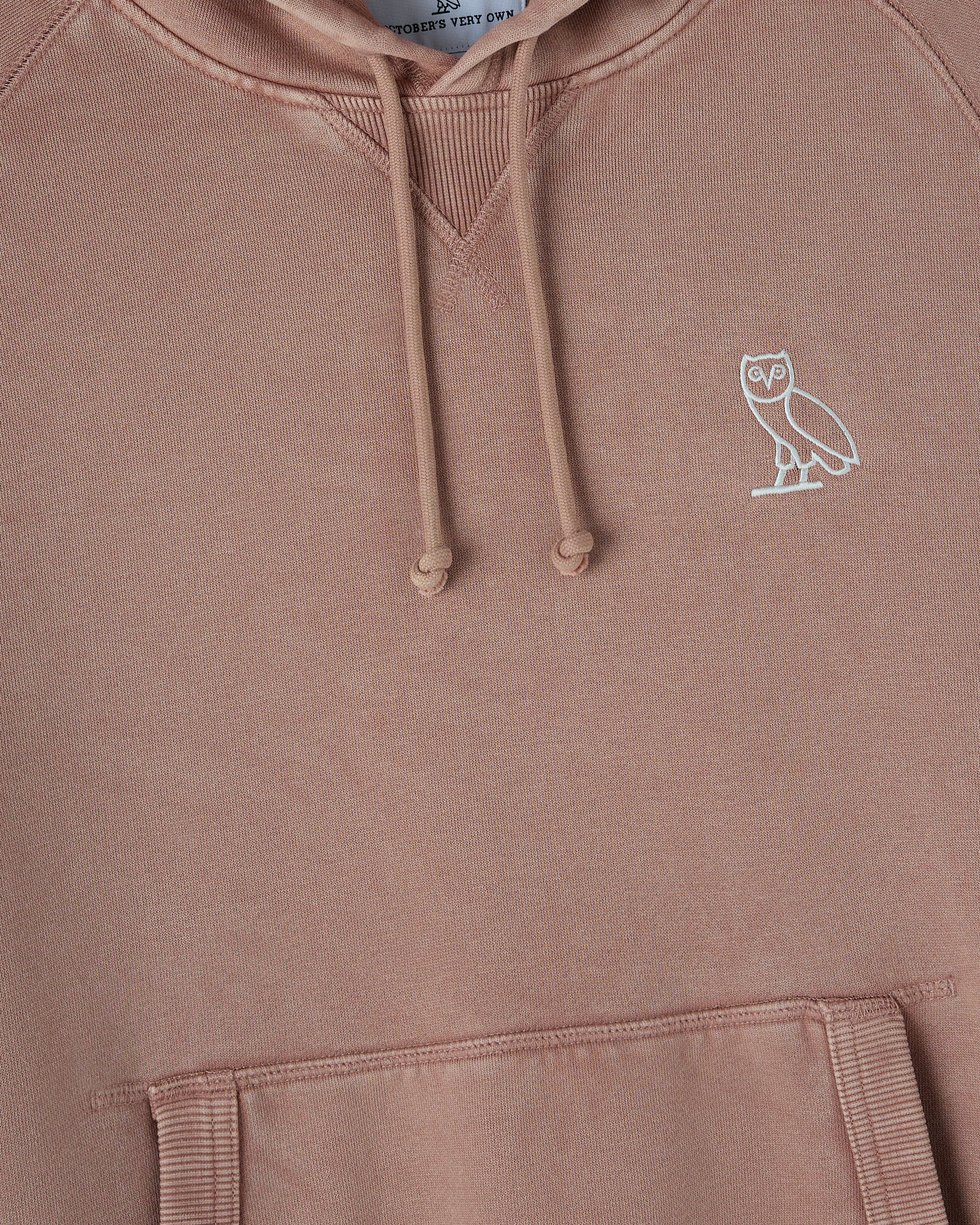 Clay pink raglan hoodie with white owl embroidery on chest and ribbed cuffs and hem.