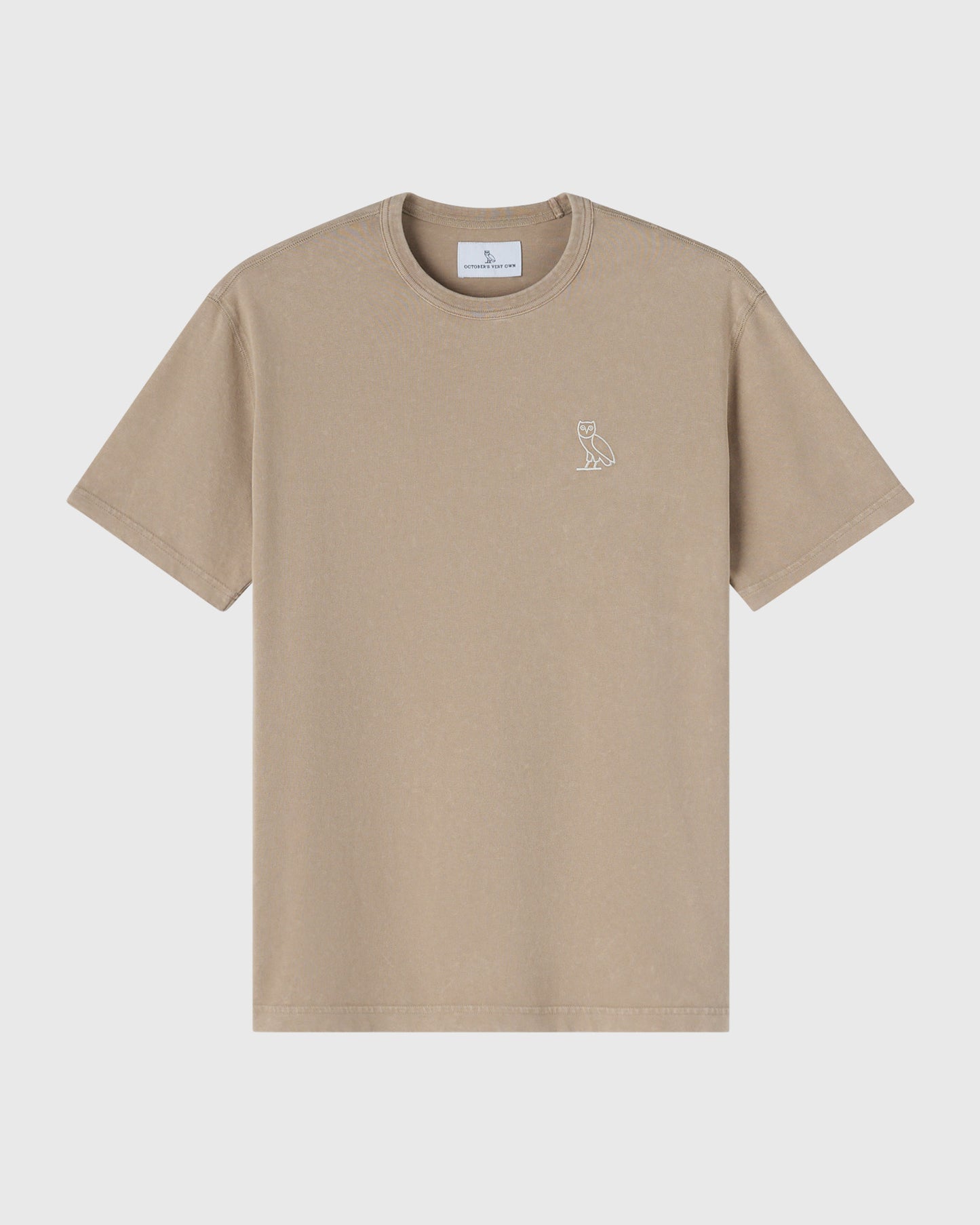Sandstone-colored crewneck t-shirt with small owl emblem on chest.