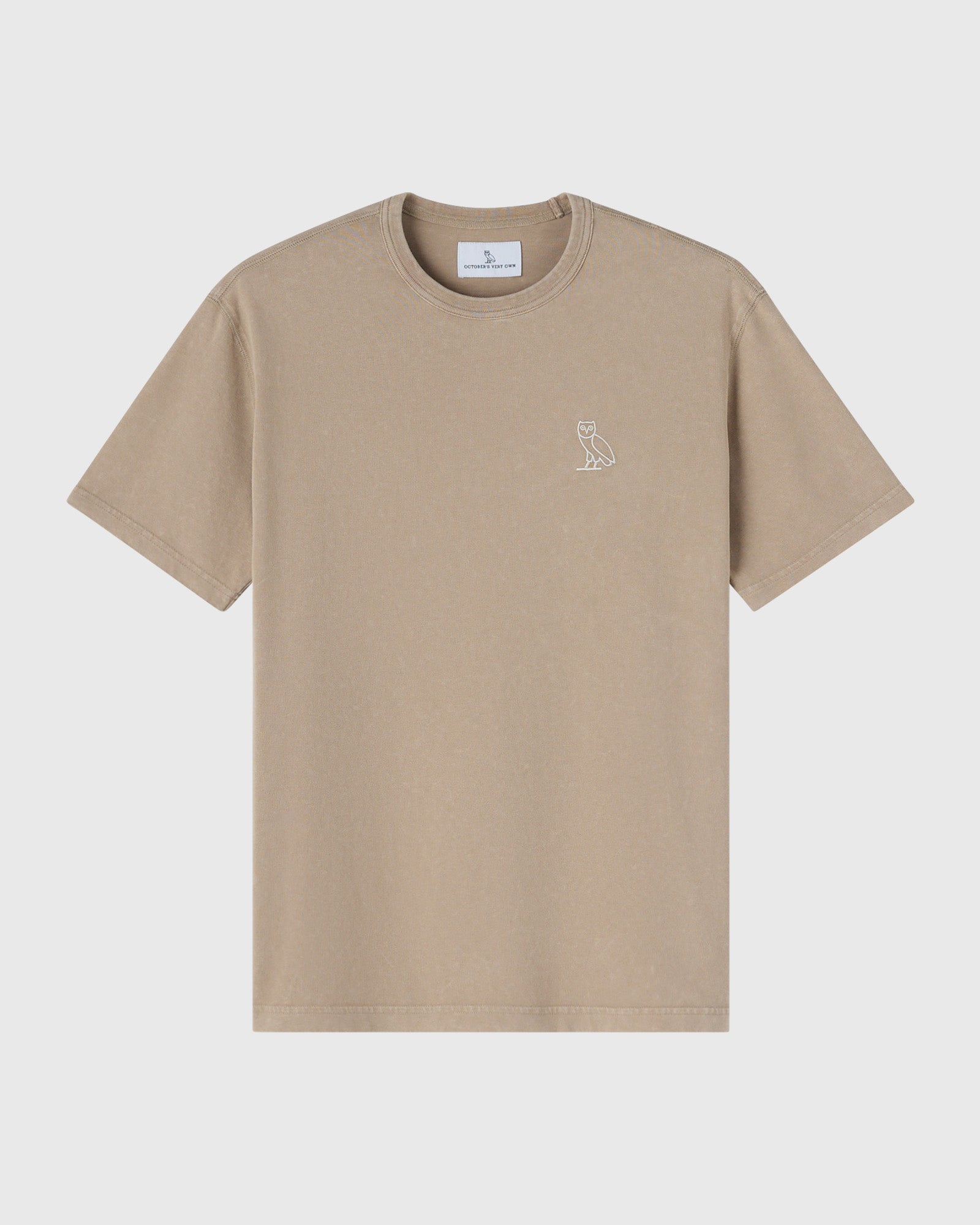 Sandstone-colored crewneck t-shirt with small owl emblem on chest.