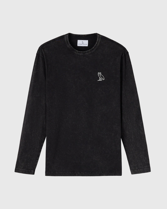 Black garment-dyed long-sleeve tee with small owl embroidery on chest and crew neckline.