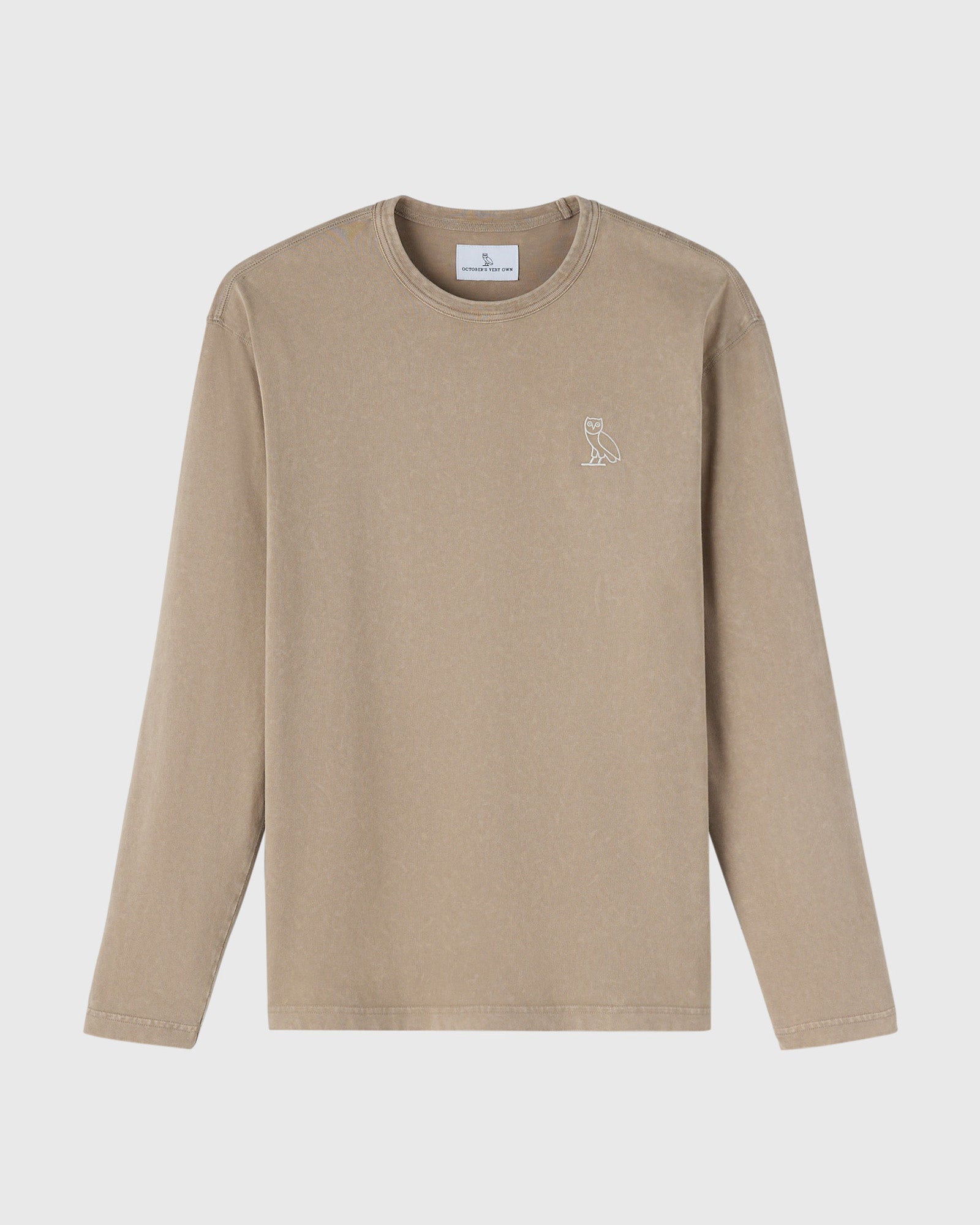 Sandstone long-sleeve tee with small owl outline embroidery on chest.