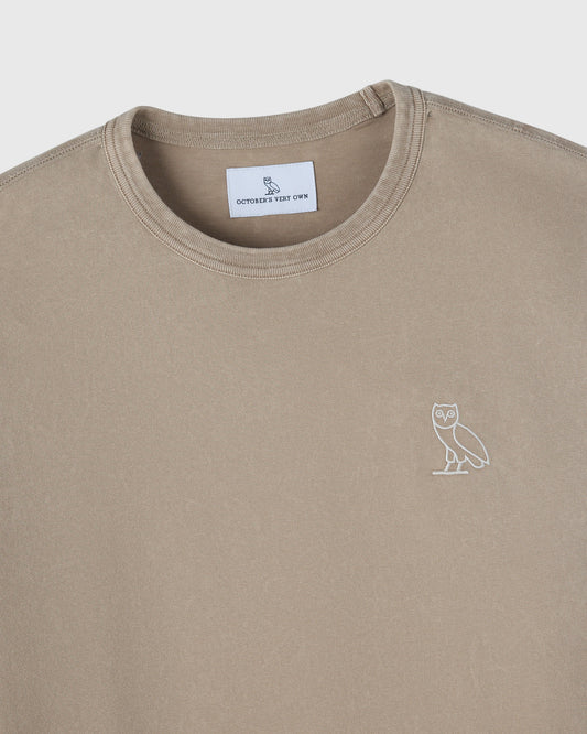 Sandstone long-sleeve tee with crew neckline and small owl embroidery on chest.