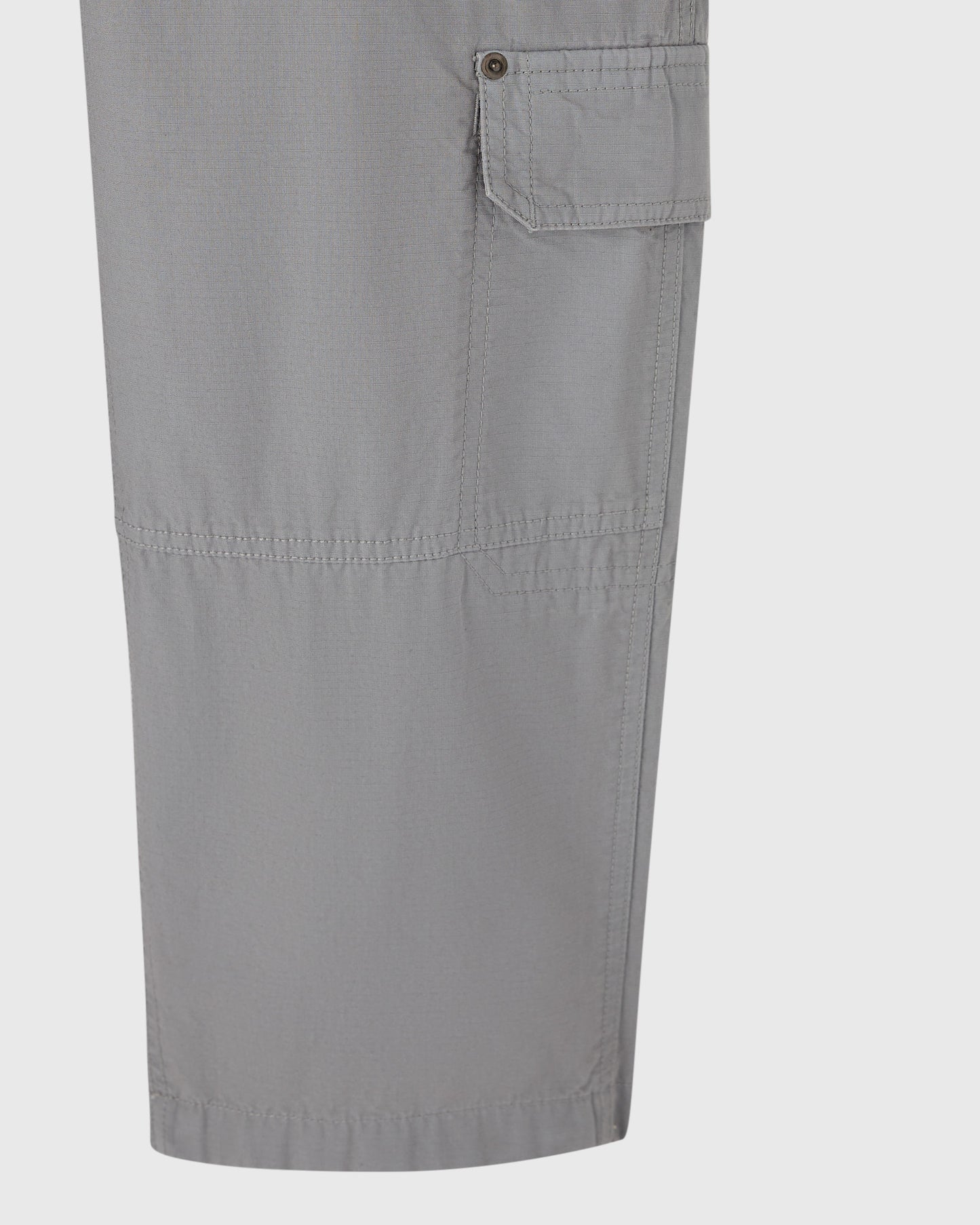Grey cargo pants with large flap pocket and utility stitching on thigh.