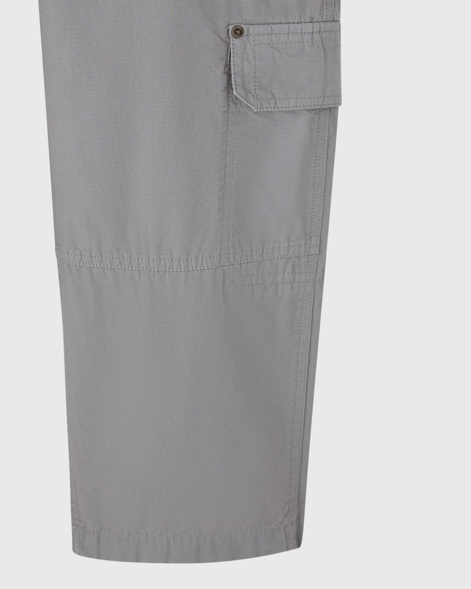 Grey cargo pants with large flap pocket and utility stitching on thigh.