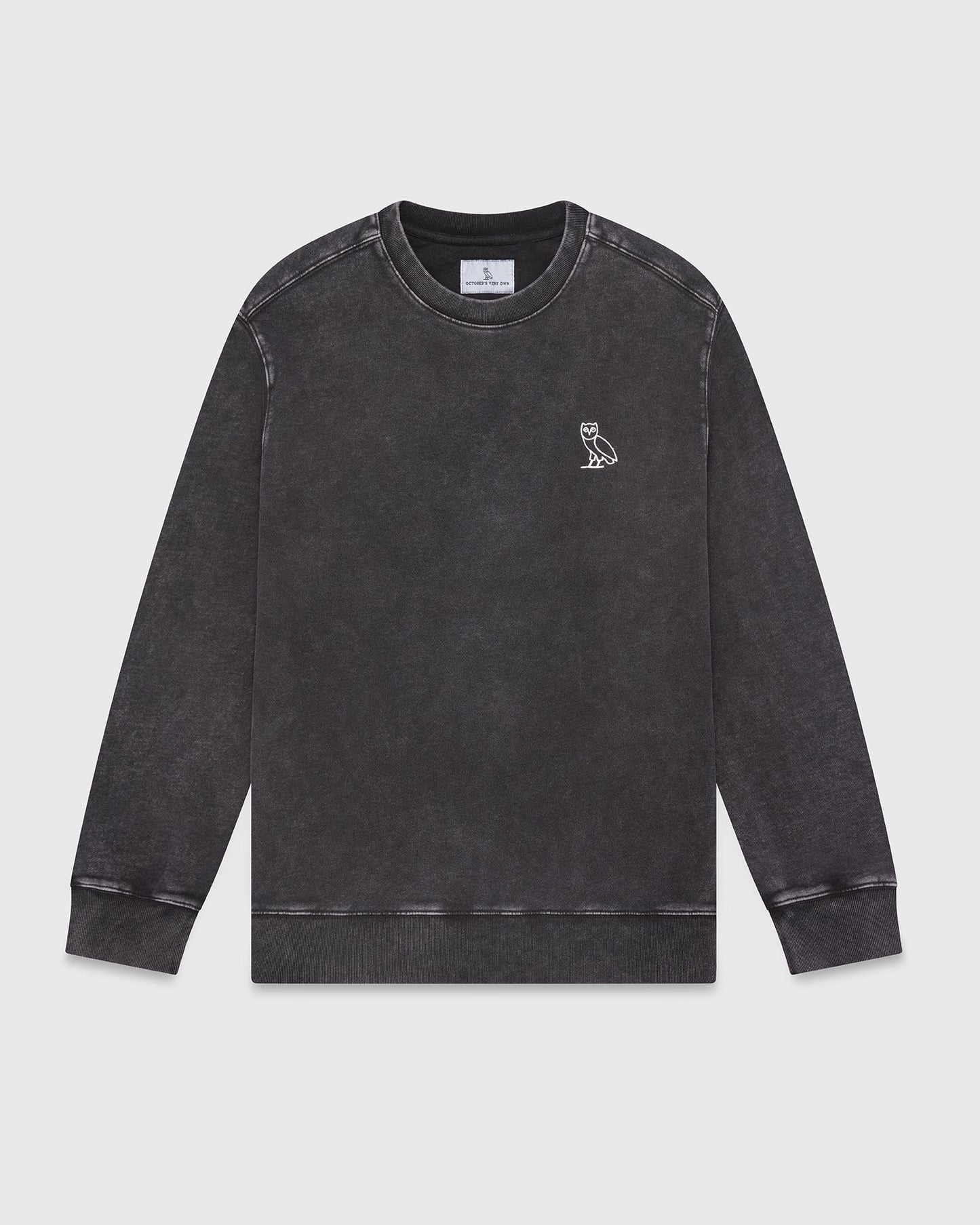 Charcoal garment-dyed crewneck sweatshirt with small owl embroidery on chest and ribbed cuffs.