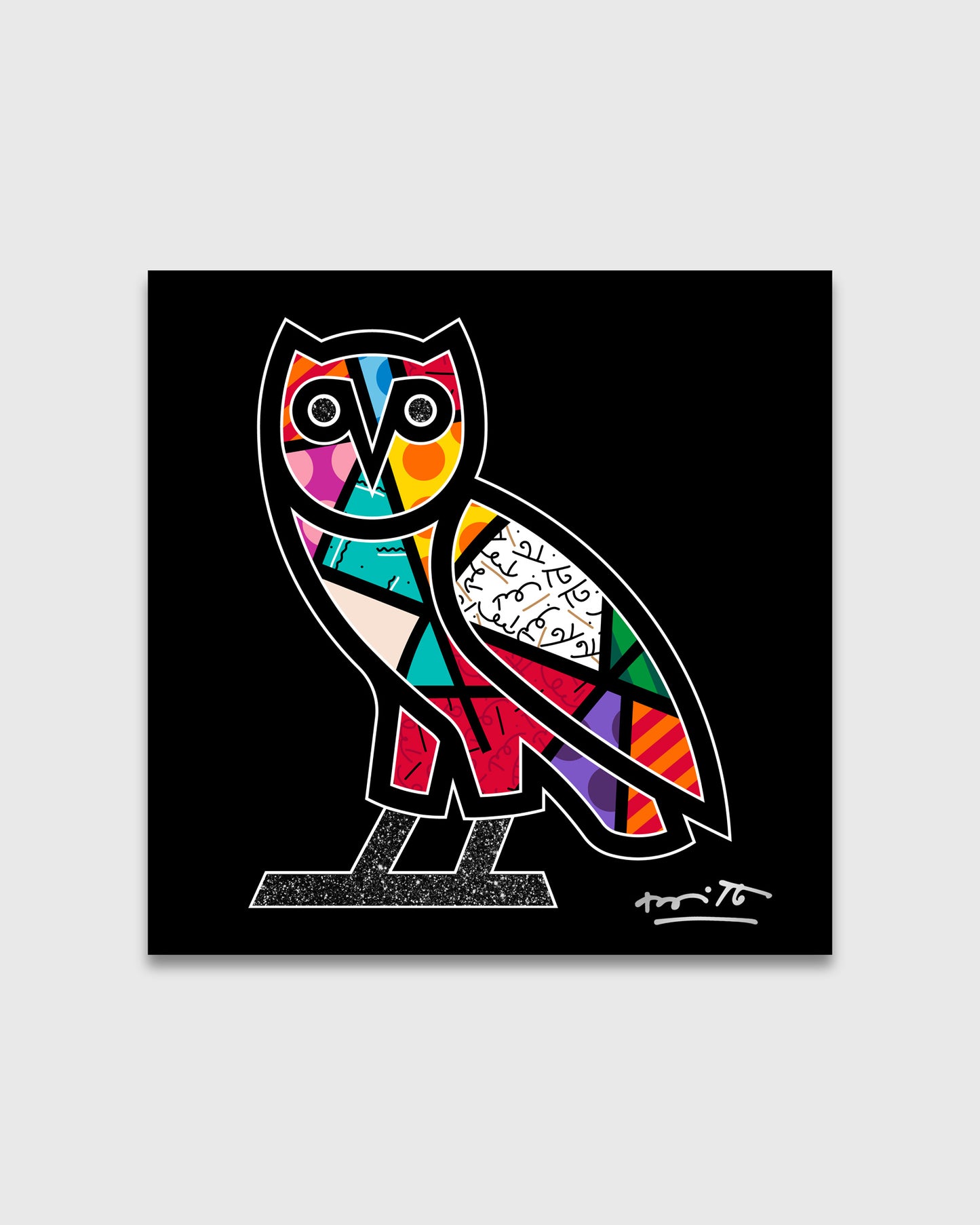 Colorful owl with geometric patterned sections in red, blue, yellow, and pink on black background with white outline.
