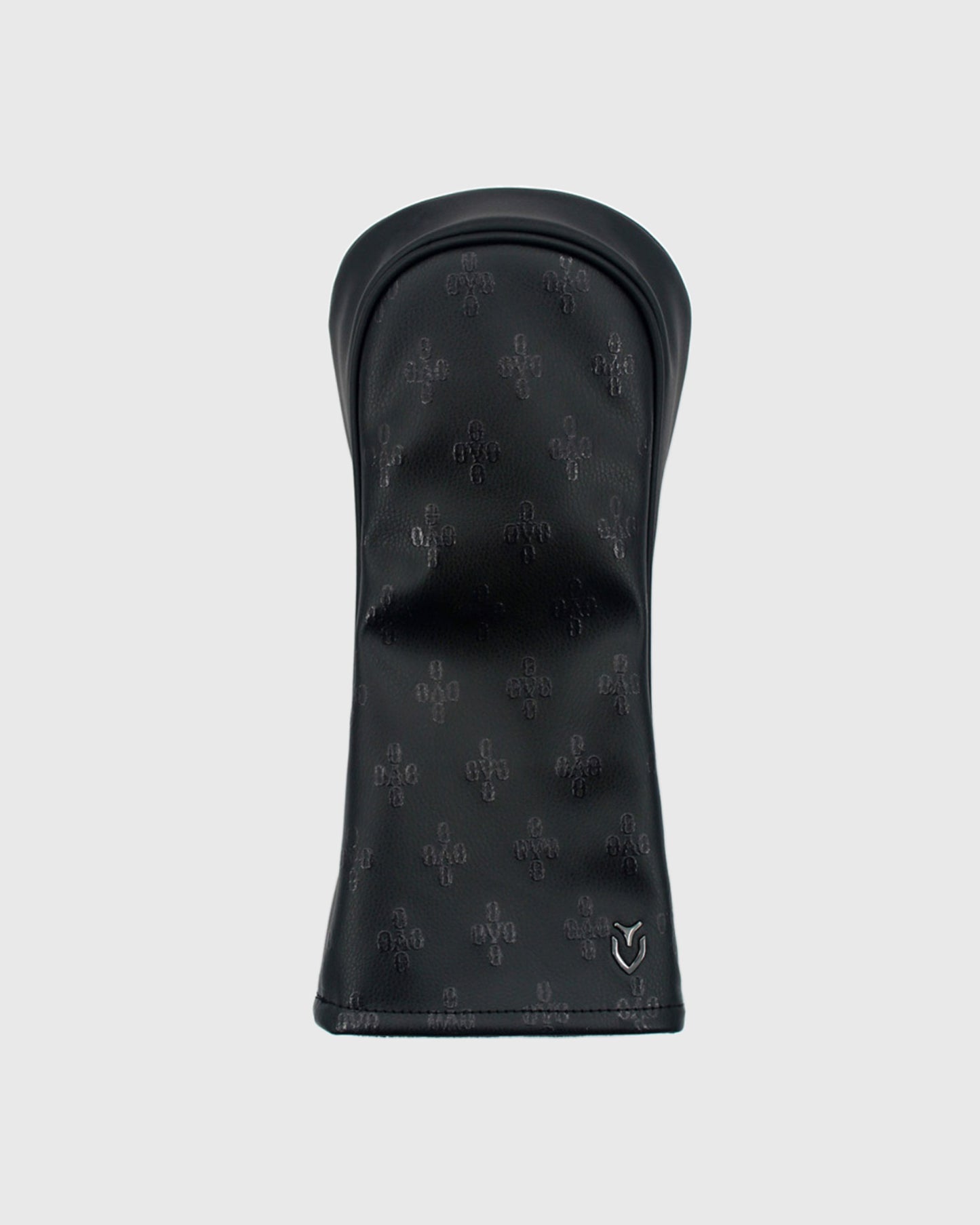 Black golf driver headcover with repeating monogram pattern and Vessel logo.