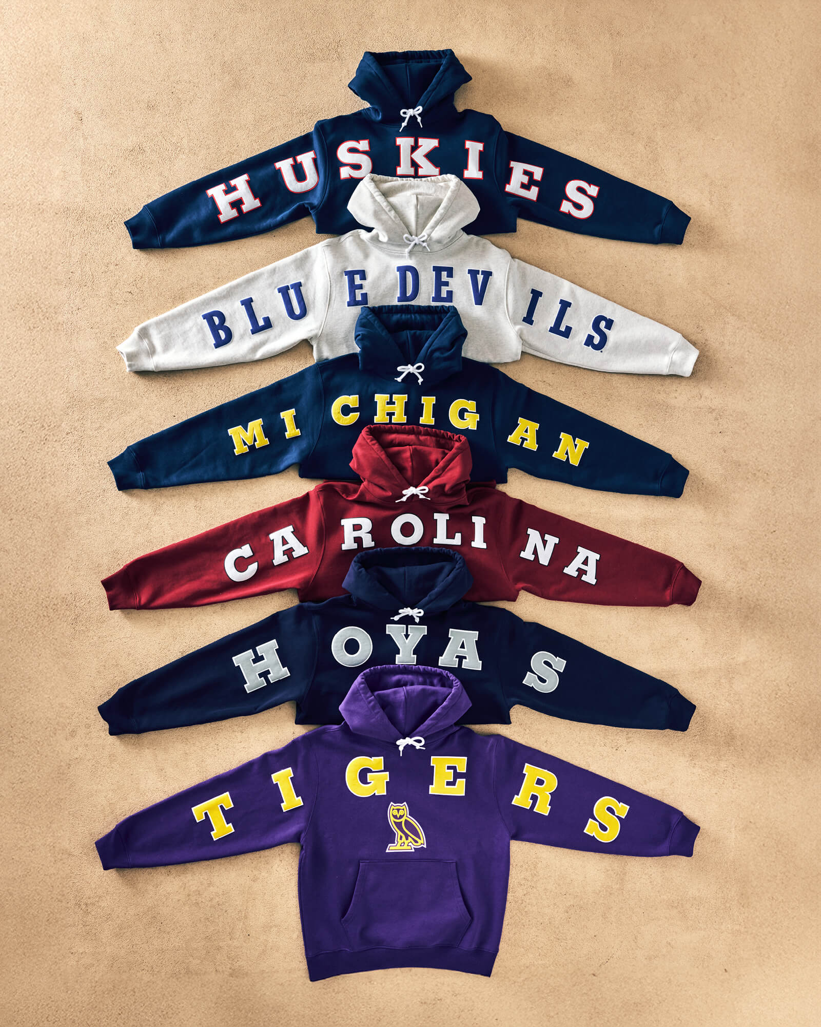 October's Very Own x College Basketball Hoodies laying flat