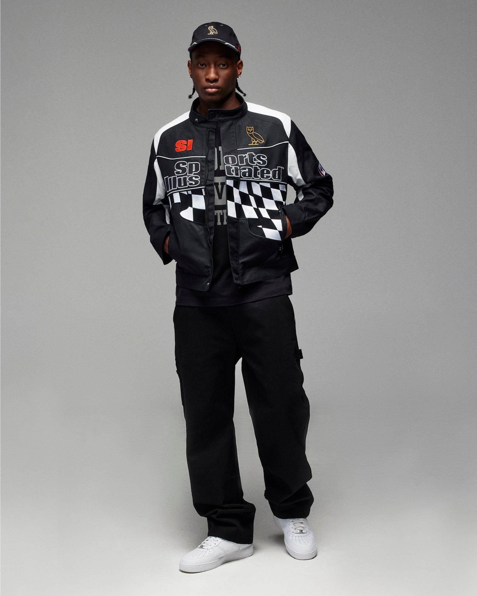 Man wearing October's Very Own x Sports Illustrated Jacket, hat and t-shirt