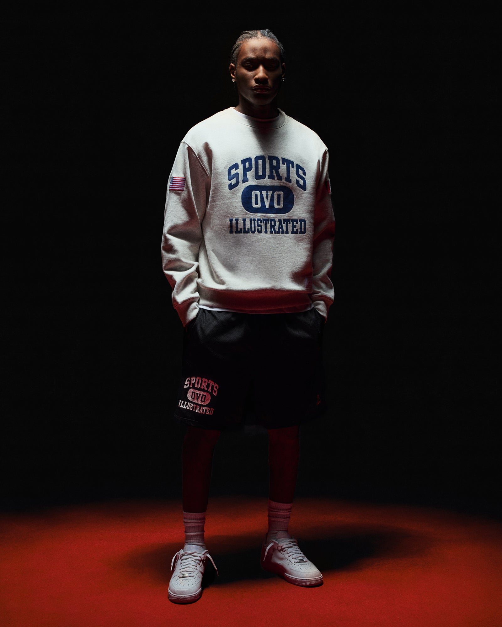 Person wearing October's Very Own x Sports Illustrated crewneck sweater