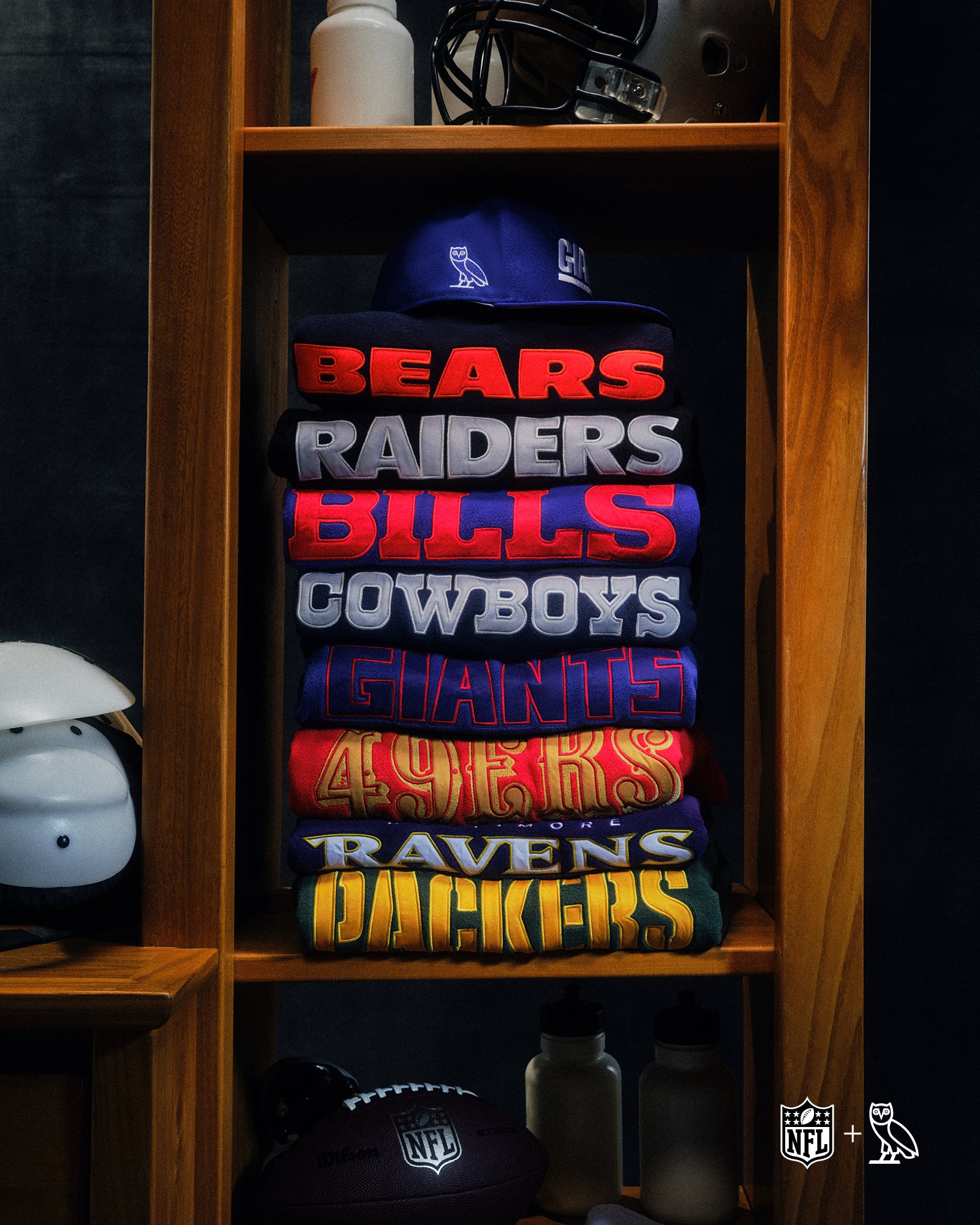 October's Very Own x NFL sweaters folded on a shelf