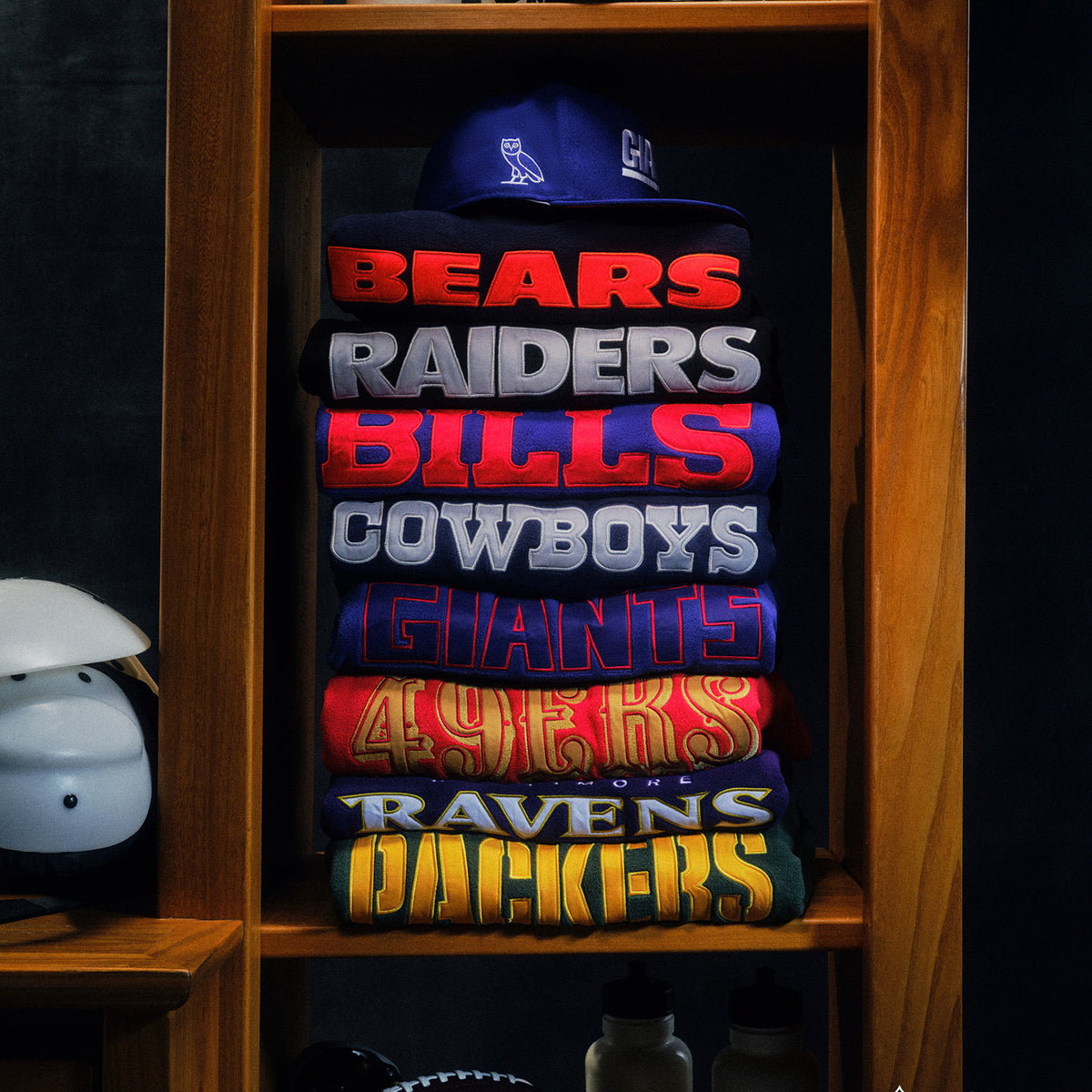 October's Very Own x NFL sweaters stacked in shelf