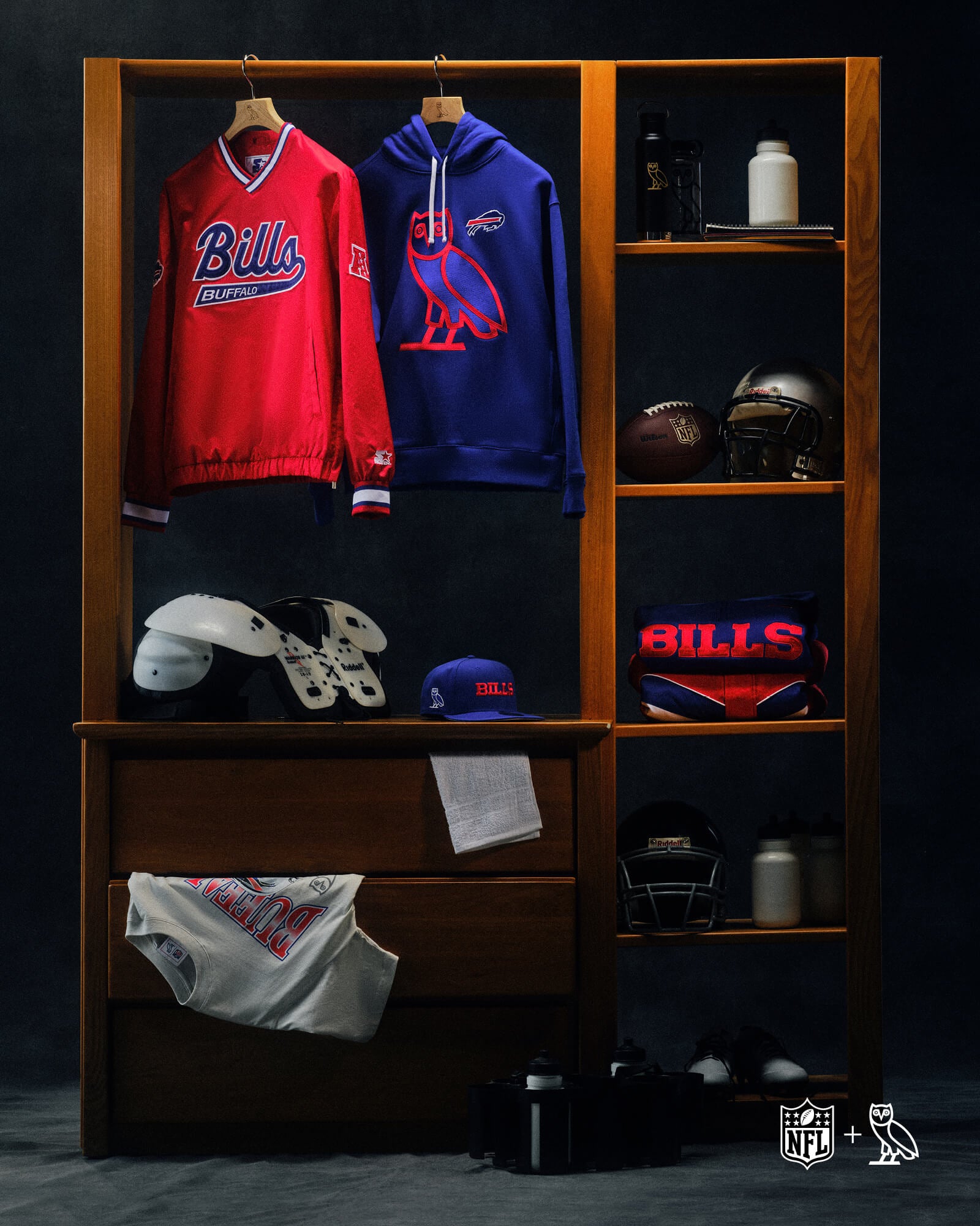 Wooden locker with October's Very Own x NFL sports gear including a red 'Bills' jersey, blue hoodie, and footballs on a dark background.