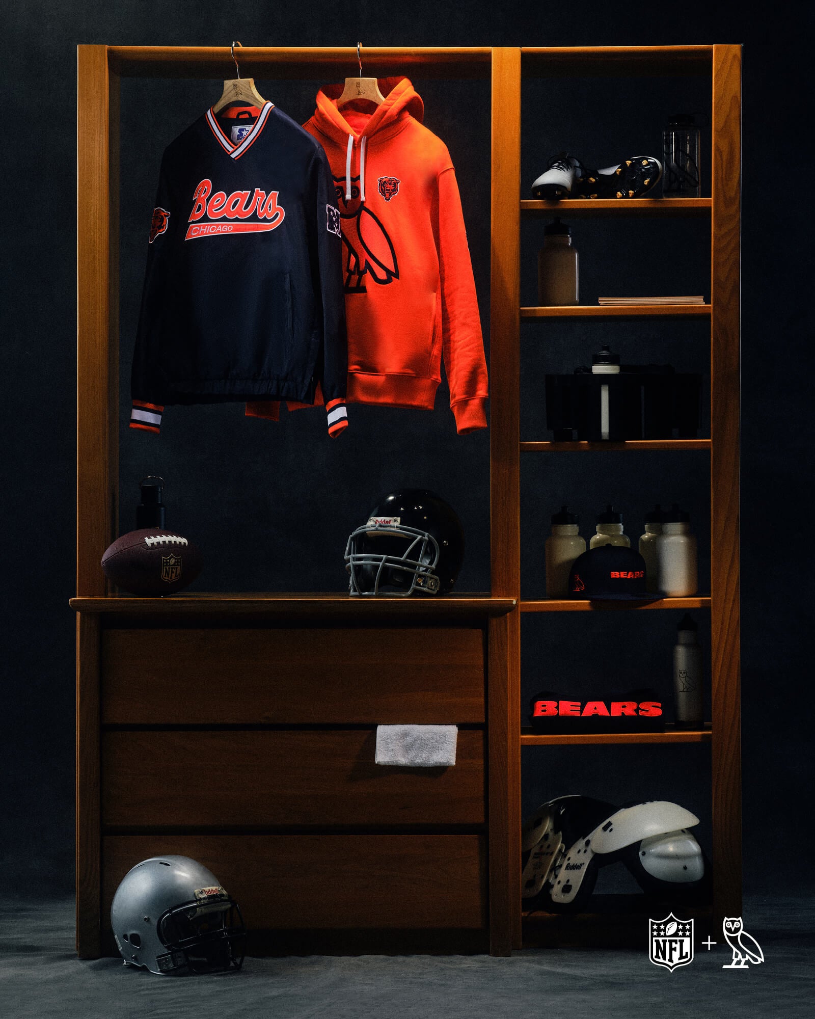 October's Very Own x NFL Clothing and sports equipment on a wooden wardrobe with NFL branding.