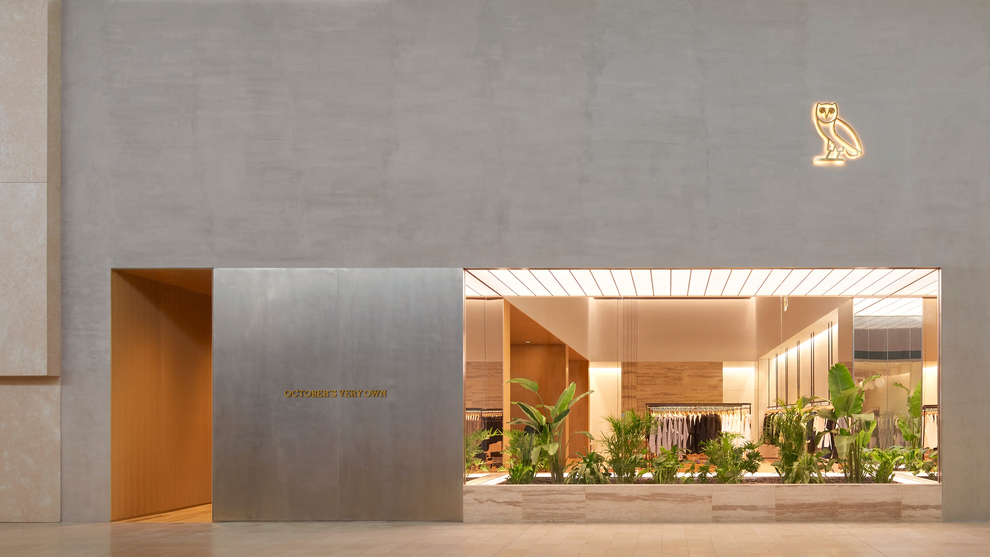 Modern building entrance with October's Very Own logo and indoor display