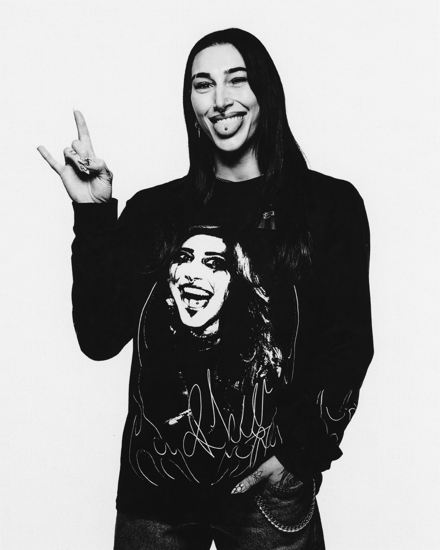 Rhea Ripley wearing a October's Very Own x WWE Long Sleeve on a white background