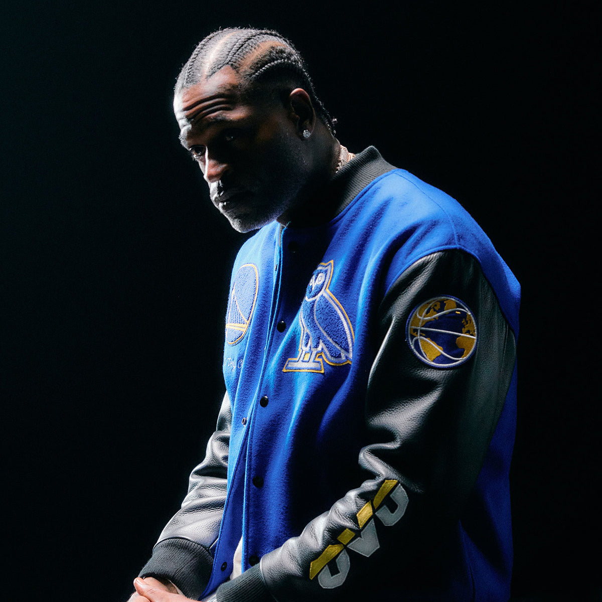 Stephen Jackson wearing a October's Very Own x NBA Varsity Jacket