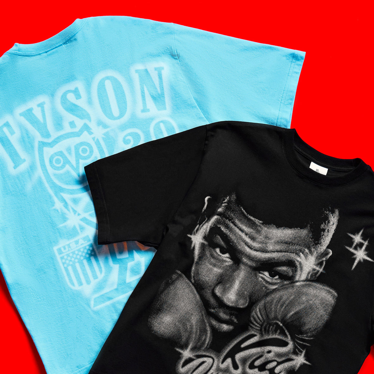 Black and blue October's Very Own x Tyson t-shirt with graphic design on a red background