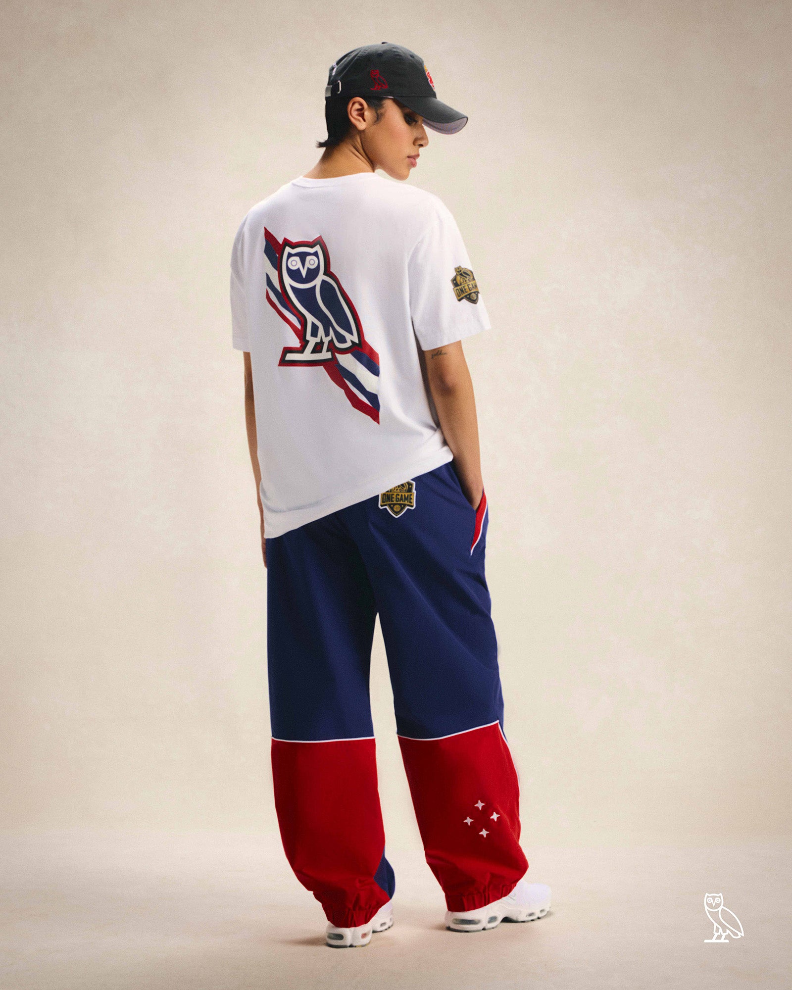 Person wearing October's Very Own / WNBA Hat, T-shirt and track pants