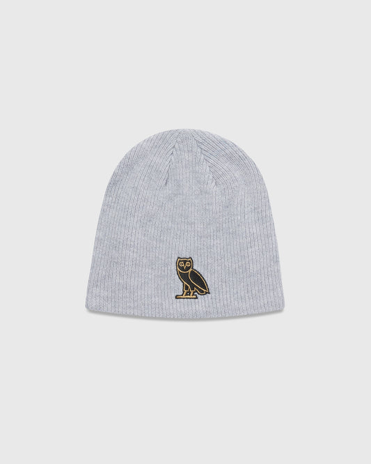Grey ribbed beanie with embroidered owl logo on front.